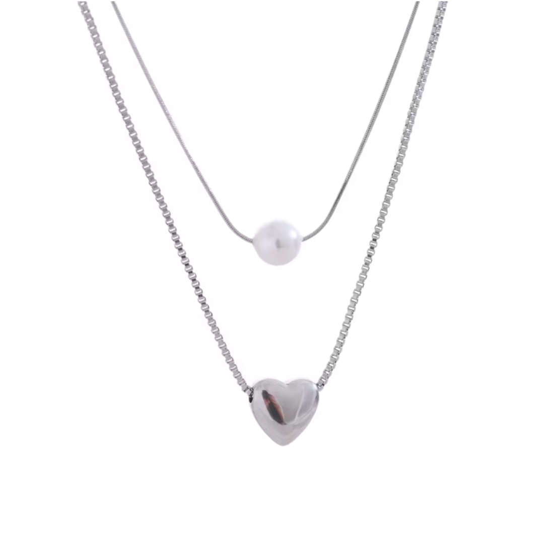 A double-layer stainless steel necklace with a delicate heart pendant and a luminous imitation pearl, featuring a rust-proof and tarnish-resistant finish for timeless elegance. 