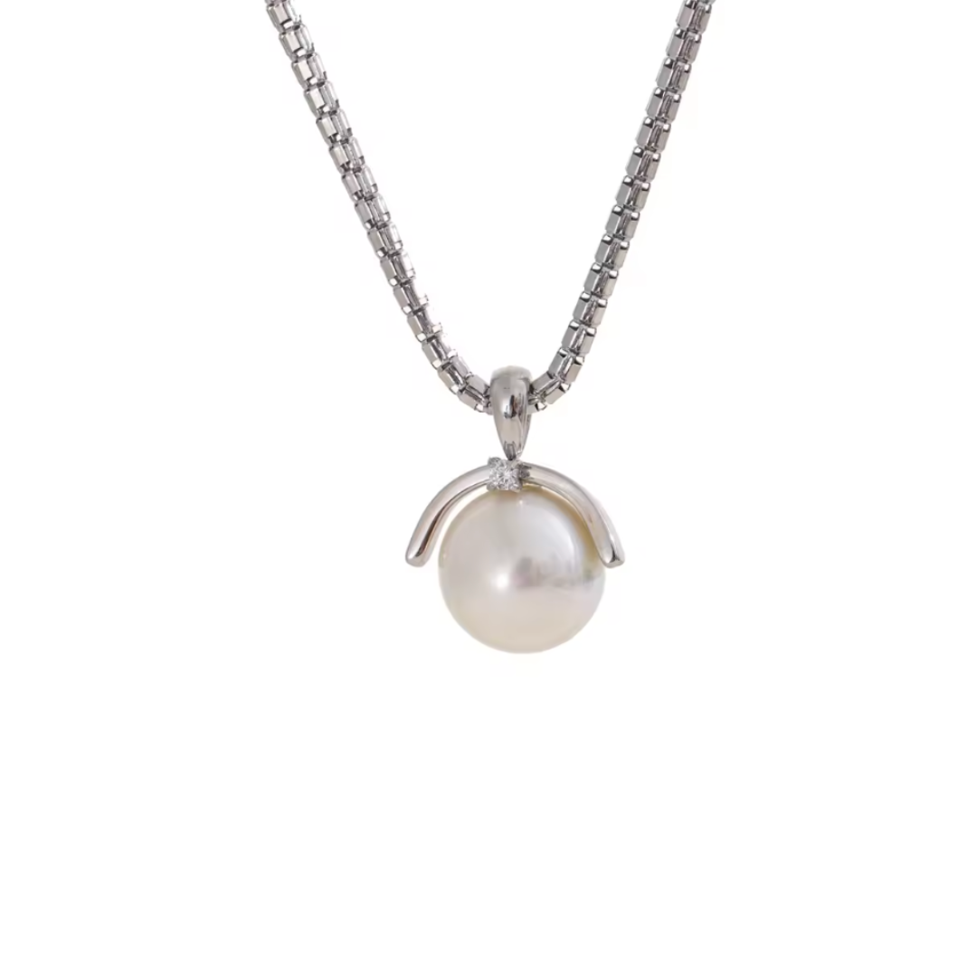 A silver stainless steel necklace featuring an elegant round simulated pearl pendant, with a tarnish-resistant finish for a timeless and versatile look.
