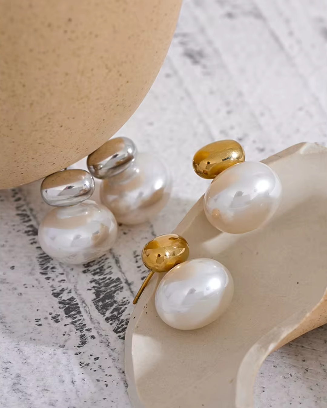 Elegant stainless steel stud earrings featuring smooth, scratch-resistant imitation pearls for a timeless and versatile look.