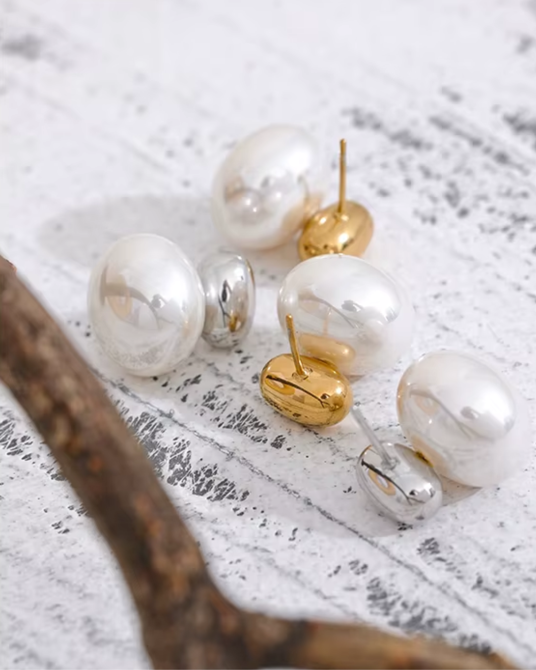 Elegant stainless steel stud earrings featuring smooth, scratch-resistant imitation pearls for a timeless and versatile look.